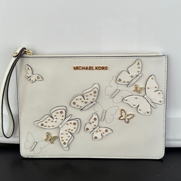 Michael Kors Handbags - Michael Kors Butterfly appliqué studded XL clutch wristlet